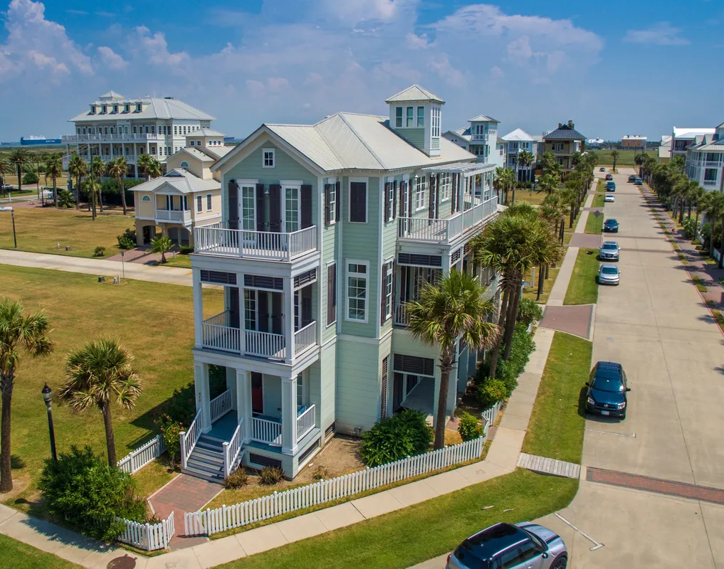Aerial real-estate photograph of a coastal home